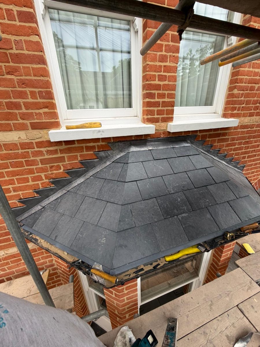 Slate hipped bay roof with lead flashing, Surrey